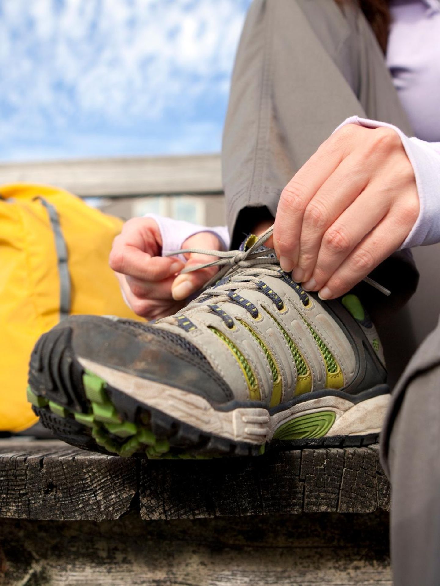 A female tying her shoe