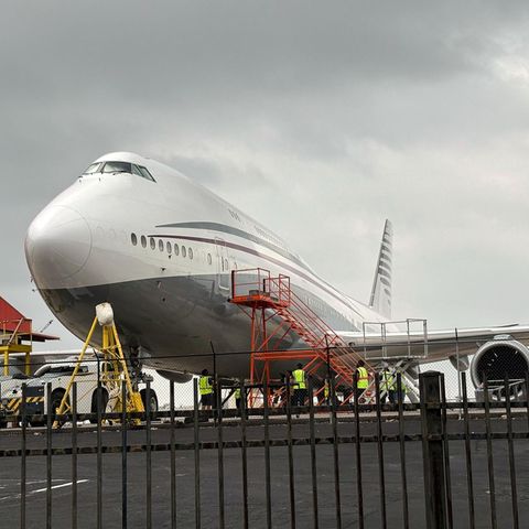 A Boeing 747 is at an airport in California