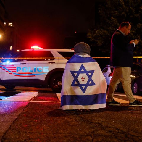 Officials of the law enforcement authorities secure the site in front of the Capital Jewish Museum in Washington, DC