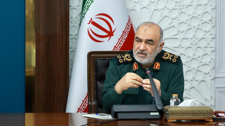 The commander -in -chief of the Corps of the Islamic Revolutionary Guard, Hossein Salami in front of a microphone.