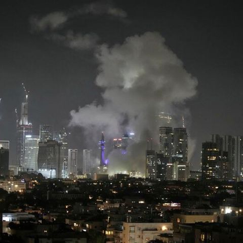 After a rocket attack on Tel Aviv, smoke rises over the city