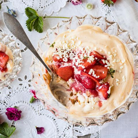 The vanilla dessert "strawberry trifle" on a nicely decorated table