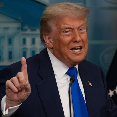 President Donald Trump caves the right index finger in the USA