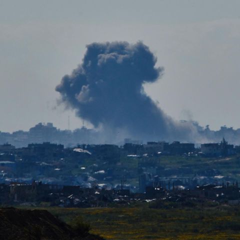 After an explosion in the Gaza Strip, smoke rises into the sky, seen from the south of Israel