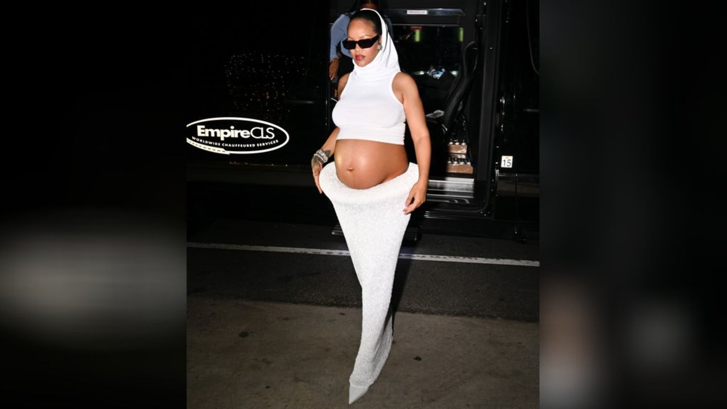 Quite in white: Rihanna makes her baby bump an eye -catcher