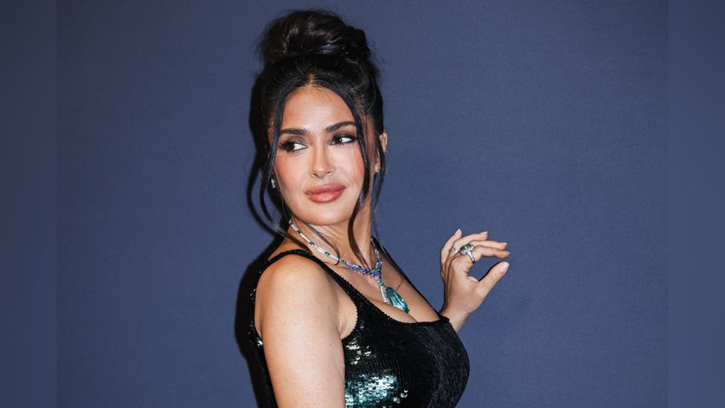 In the white mini-bikini: Salma Hayek swings her hips