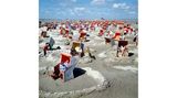 Strandkörbe umrundet von Sandburgen