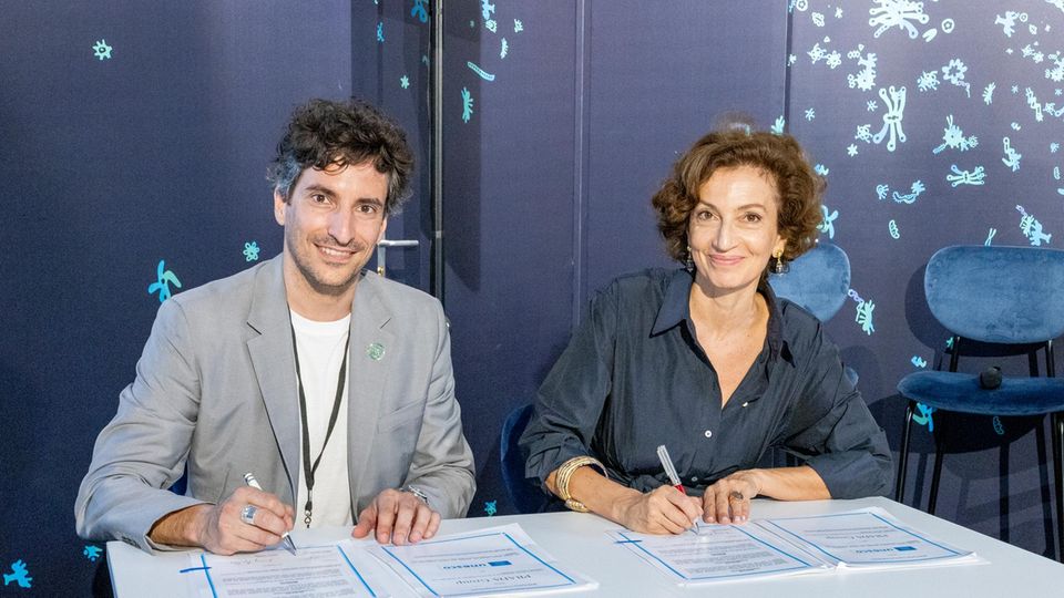 Rolex and Prada: Lorenzo Bertelli alongside an UNESCO employee