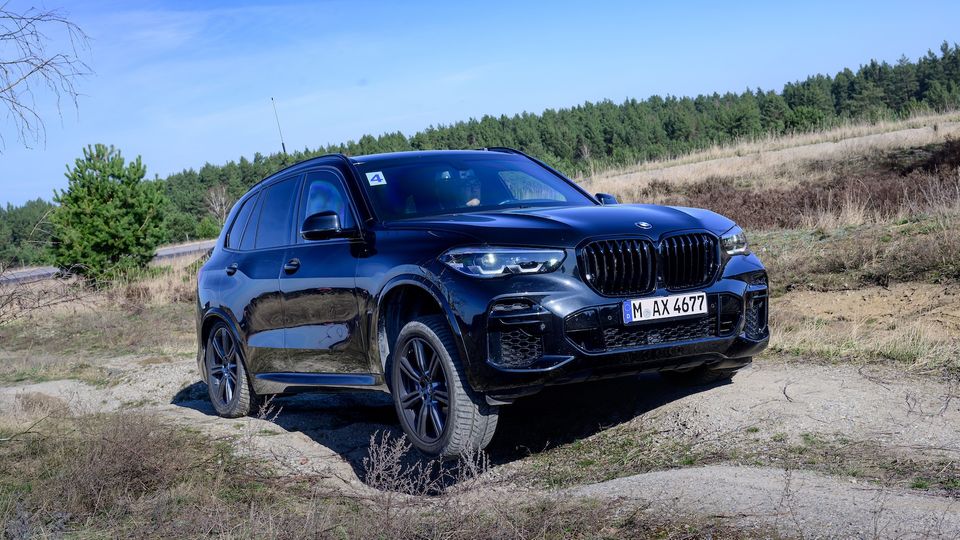 Government heads: Black BMW X5 on a site