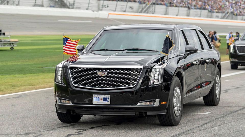 The heads of government cars: Donald Trump's limousine drives through a stadium