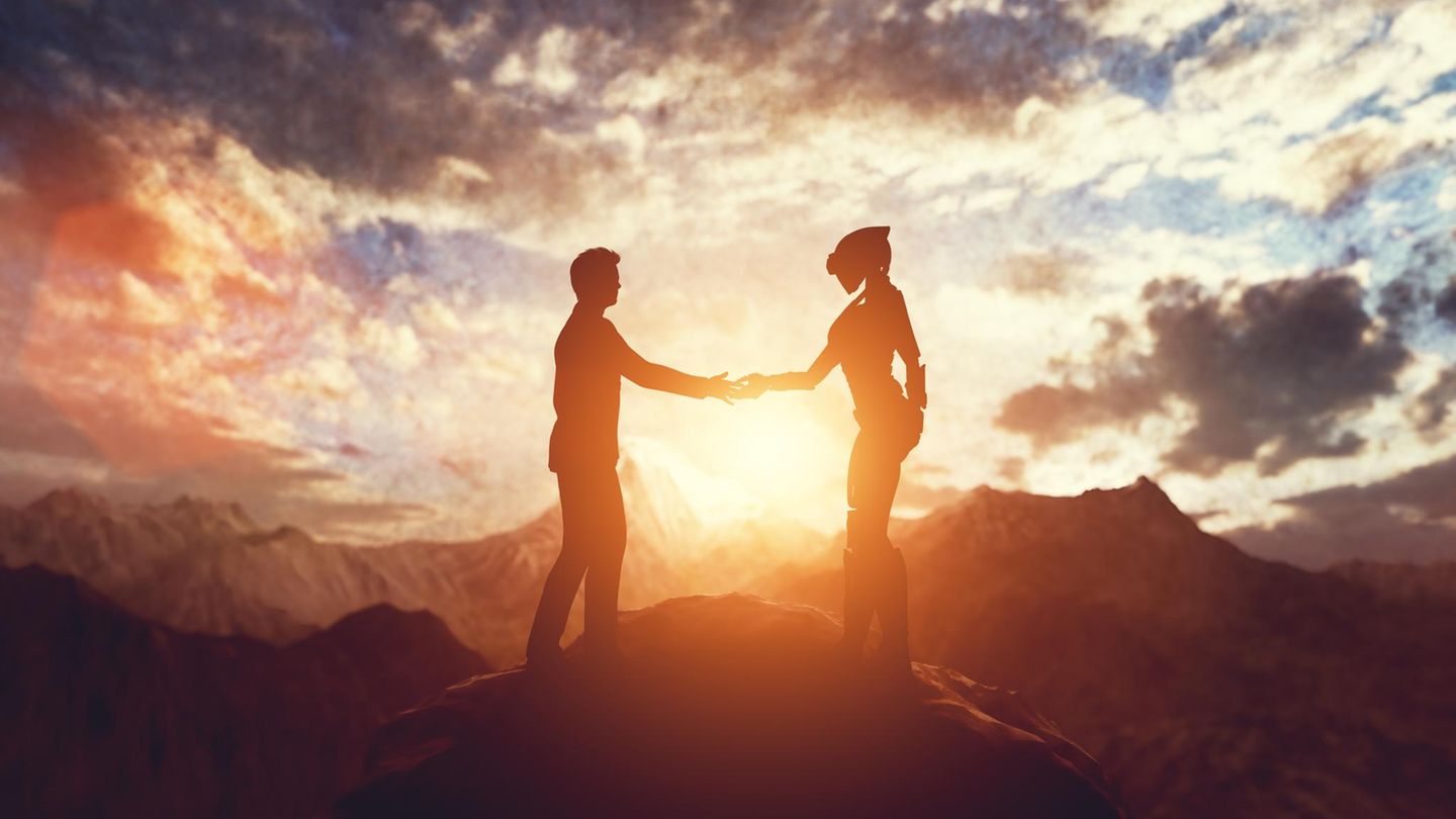 Ein Mensch und ein Alien geben sich die Hand, das Weltall im Hintergrund Ein Mensch und ein Alien geben sich die Hand, das Weltall im Hintergrund