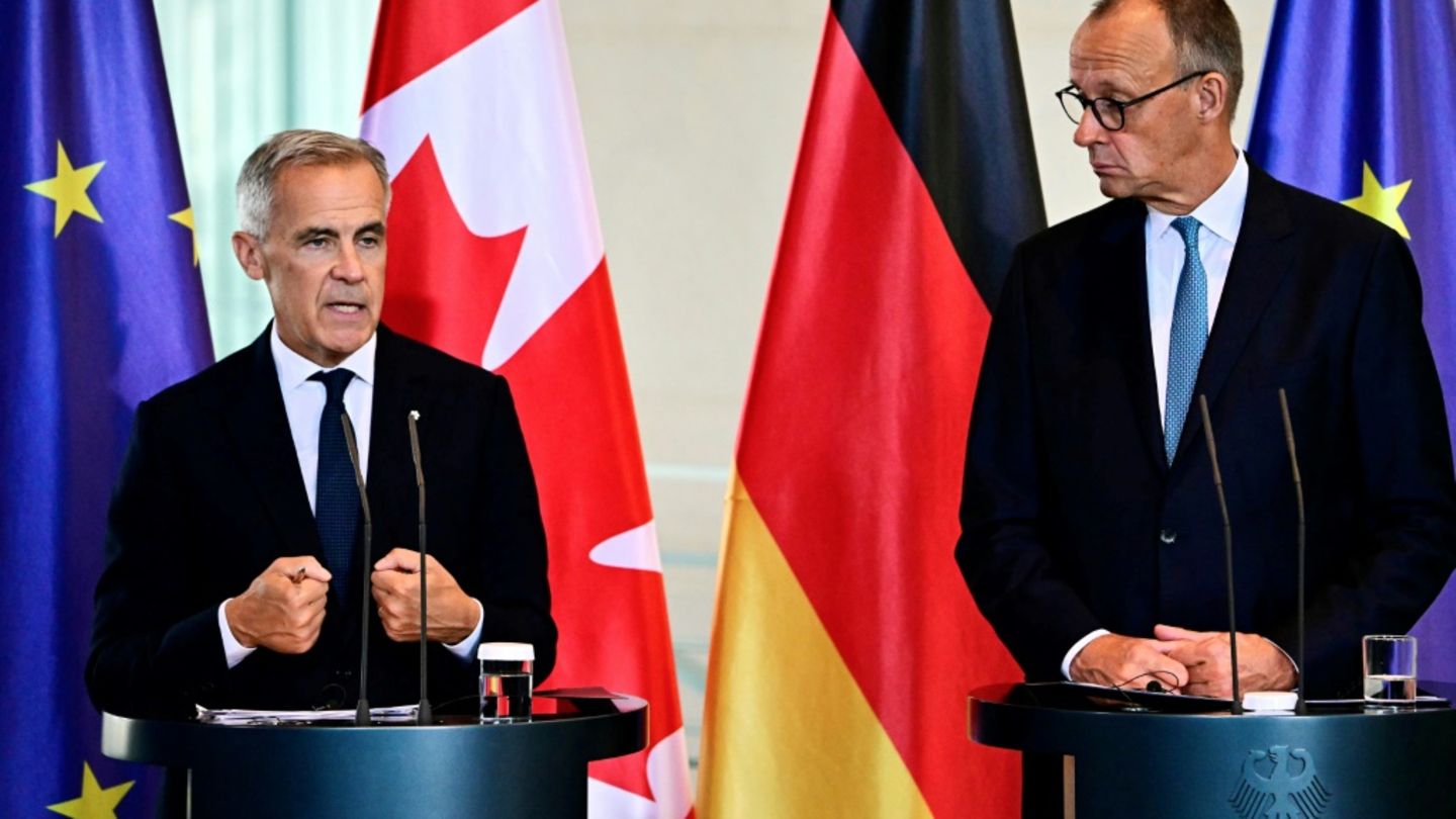 Mark Carney (l.) und Friedrich Merz