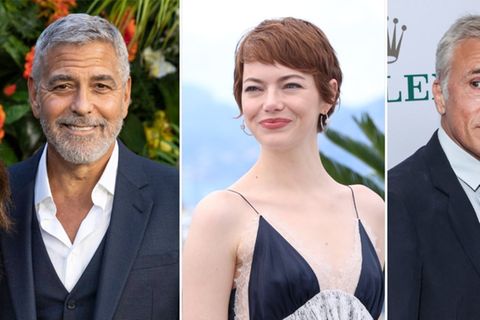 George Clooney (l.), Emma Stone und Christoph Waltz befinden sich 2025 allesamt im Wettbewerb um den Goldenen Löwen von Venedi