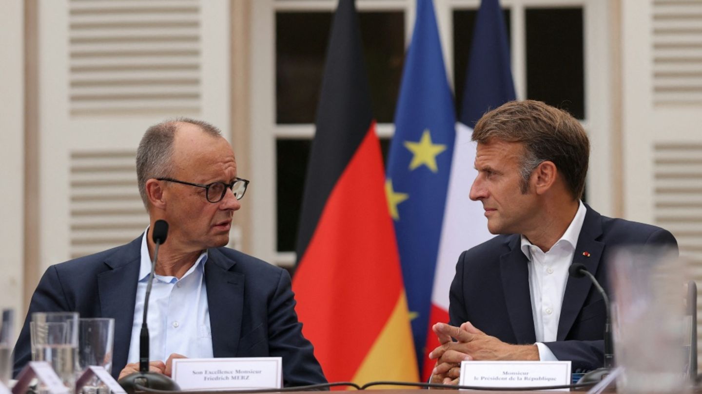 Merz (l.) und Macron