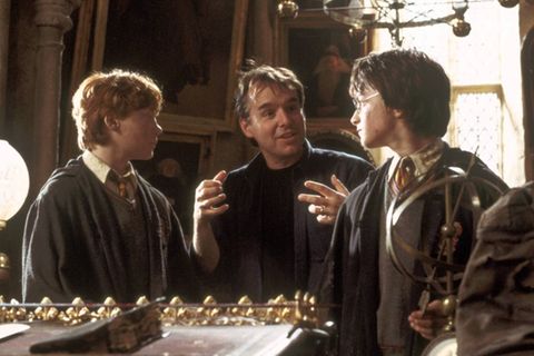 Chris Columbus (M.) am Set mit Rupert Grint (l.) und Daniel Radcliffe.