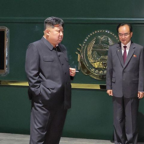 North Korea's ruler Kim Jong-un in front of his train