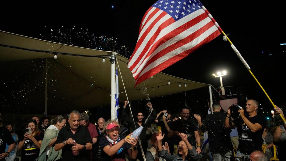 Relatives and supporters of the Israeli hostages celebrate in Tel Aviv