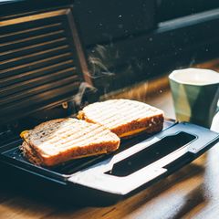 Making sandwich for breakfast.