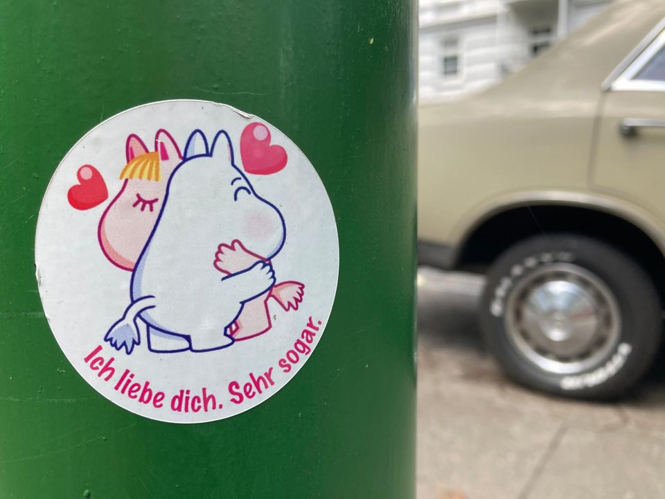 Sticker with two hippos hugging each other Sticker with two hippos hugging each other