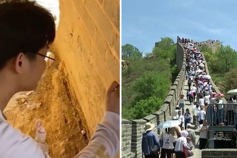 Touristen ritzen ihre Namen in Chinesische Mauer