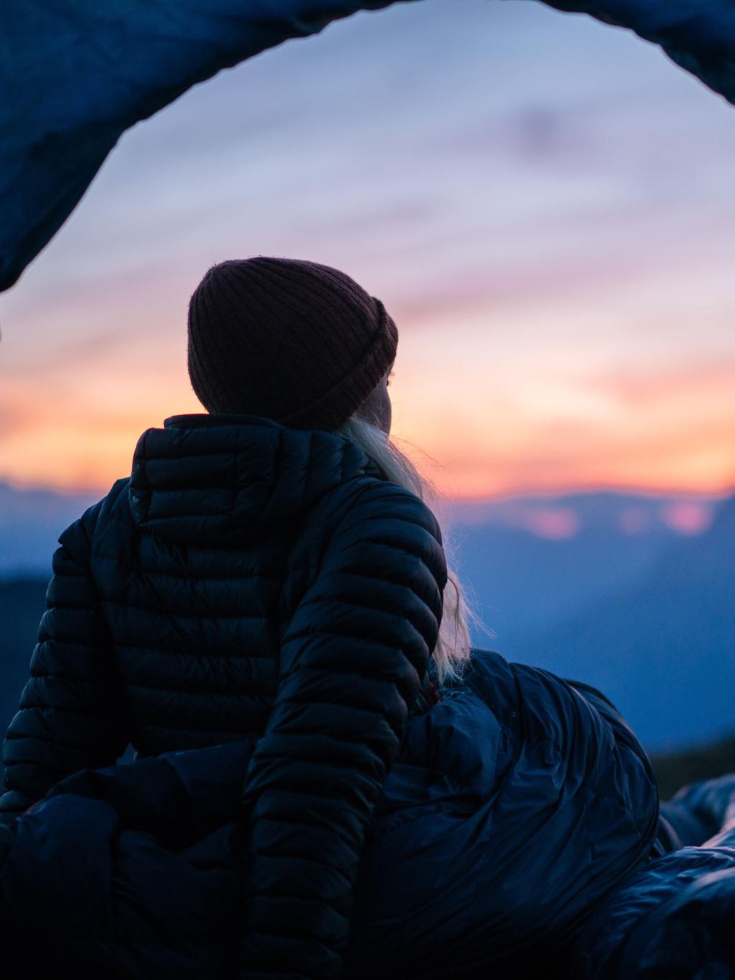Hiker camps out in high mountain landscape