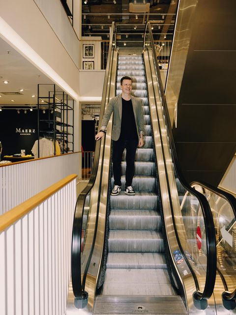 Kaufhaus-Betreiber Greiner auf Rolltreppe