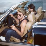 George Michael mit Sonnebrille am Steuer eines Cabrios