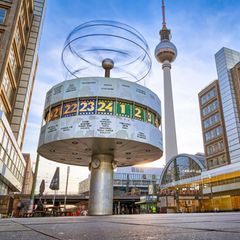 Long term exposure, panoramic view on the Urania World Clock in Berlin and TV Tower on the Alexander Square,  a tourist attraction and meeting place