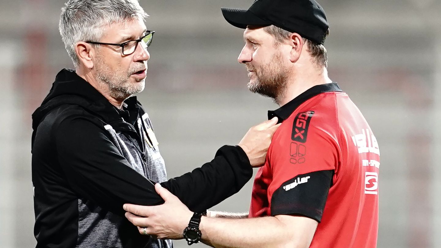 Urs Fischer (l.) und Steffen Baumgart (r.) sehen sich bald in der Bundesliga wieder. Foto: Kay Nietfeld/dpa