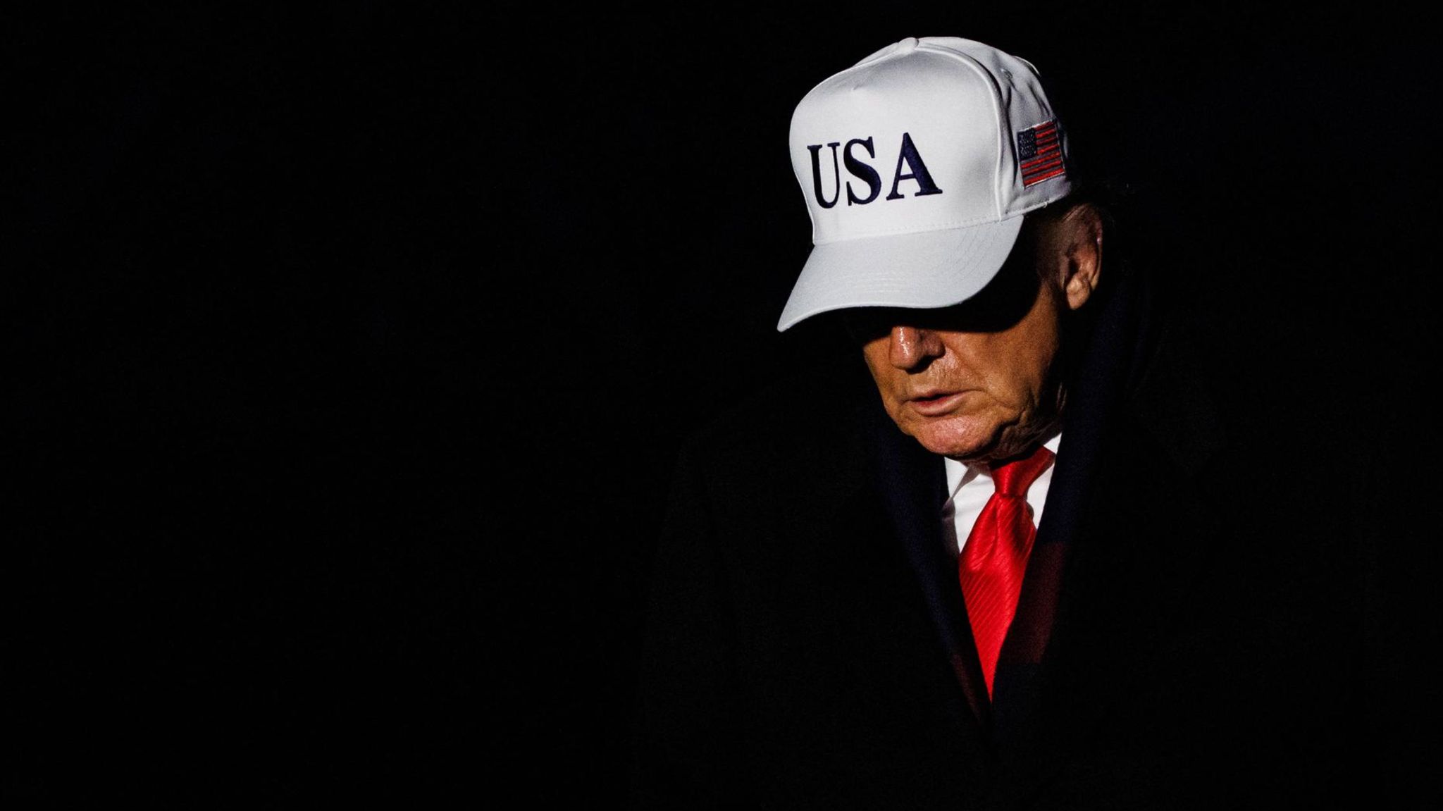 US President Donald Trump wears a USA cap