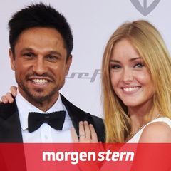 Daniel Aminati und Patrice Aminati posieren gemeinsam auf einem Empfang