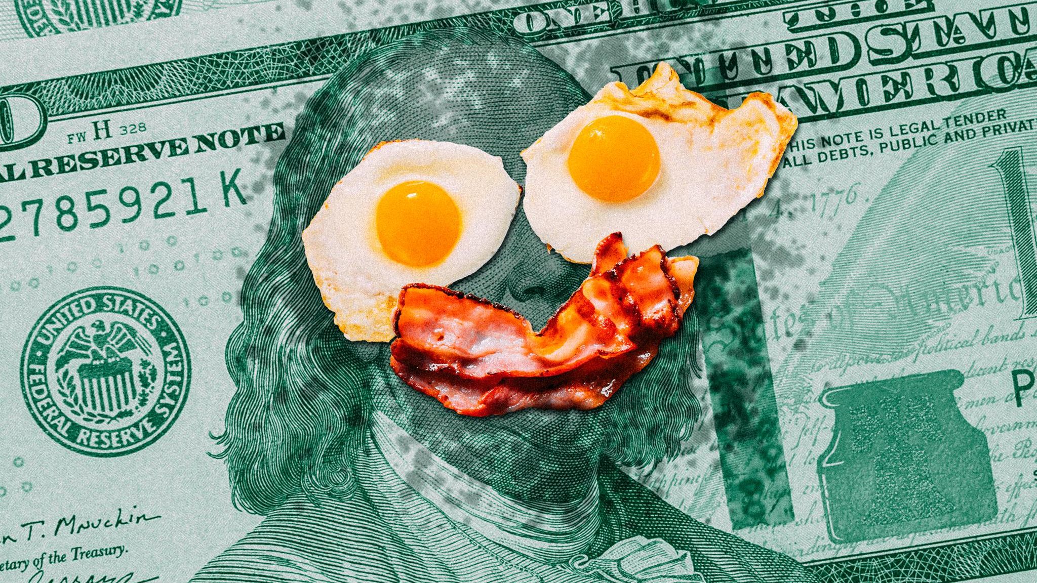 New York: Auf einer Dollar-Note liegen zwei Spiegeleier und ein Stück Bacon