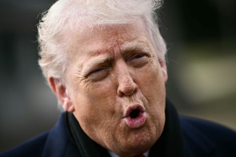 US President Donald Trump speaks to the press before boarding Marine One as he departs from the South Lawn of the White House in