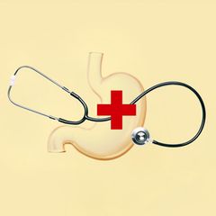 Montage zeigt ein Stethoskop auf der Darstellung eines Magens liegend