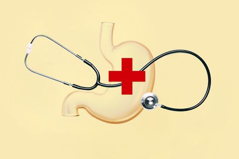 Montage zeigt ein Stethoskop auf der Darstellung eines Magens liegend