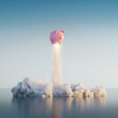Ein Sparschwein fliegt in die Luft