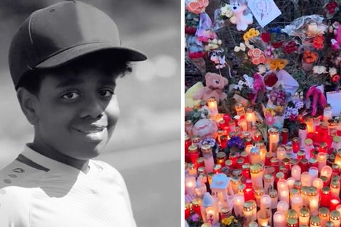 Menschen legen Kerzen und Blumen für den getöteten Yosef nieder.