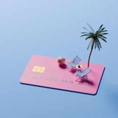 Flupreise: Kreditkarte mit Liegestuhl und Palme