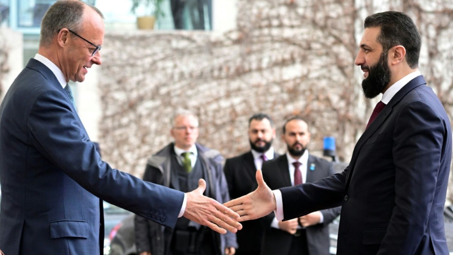 Merz (l.) und al-Scharaa