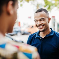 Portrait of a man wearing red polo shirt with skyscrapers of Miami Downtown in background