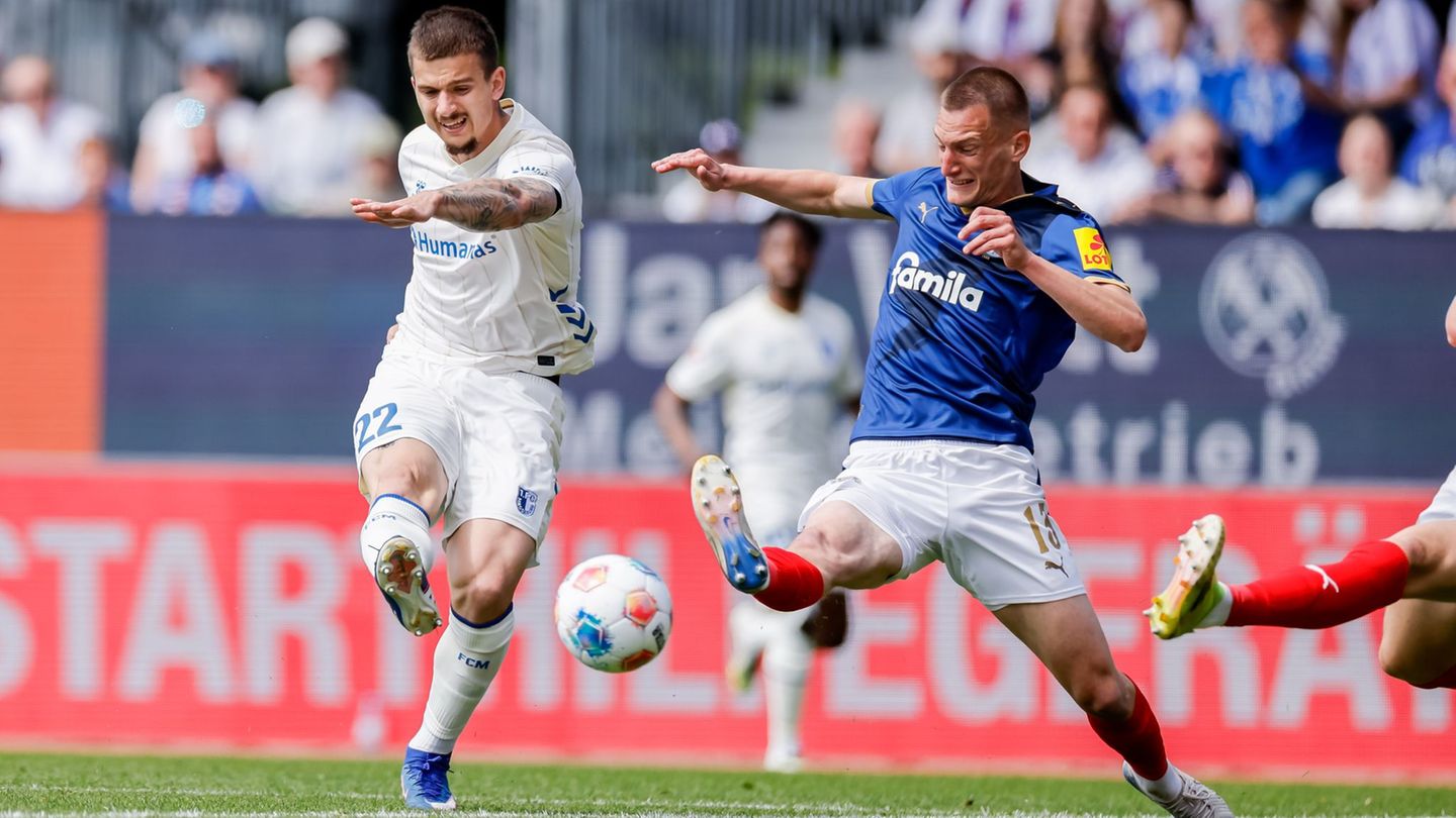 Mateusz Zukowski (l) blieb in Kiel ohne Treffer. Foto: Philipp Szyza/dpa