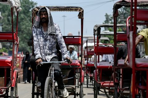 Rikscha-Fahrer in Neu Delhi