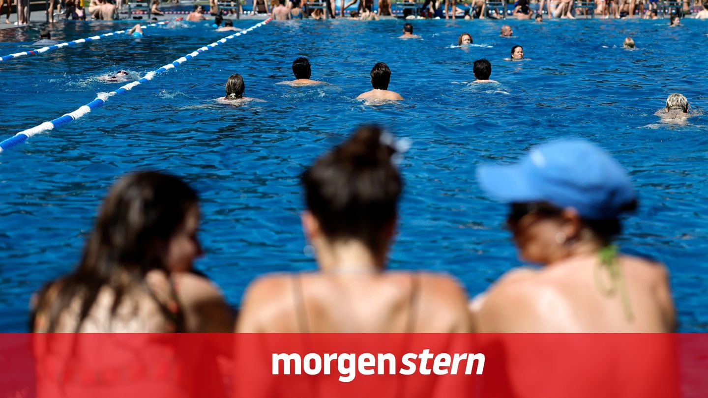 Badegäste im Freibad – DLRG warnt