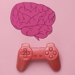 Ein aus Papier ausgeschnittenes Gehirn und ein Controller soll versinnbildlichen wie Gaming Gehirn und Psyche stärken kann