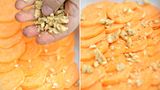 Schritt 3: Jetzt belegen wir die erste Schicht. Eine Handvoll Walnüsse und Cashews zerkleinern, Klaus Breinig macht das mit bloßen Händen. Die Splitter dann über die erste Schicht verteilen.