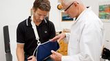 examination; 55; 60; appointment; appointments; arm; arms; case; cases; daylight; doctor; doctors; health; indoor; indoors; injuries; injury; inside; man; medical; men; people; sports injuries; sports injury; sprain; sprains; visit; visits; consultation