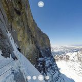Am berühmten Hinterstoißer-Quergang: Hier müssen die Alpinisten in der Horizontalen nach rechts klettern. Das Seitenmenü lässt sich ausblenden, die Buttons am unteren Bildrand erlauben den Wechsel zwischen zu 360°-Aufnahmen und 360°-Videos.