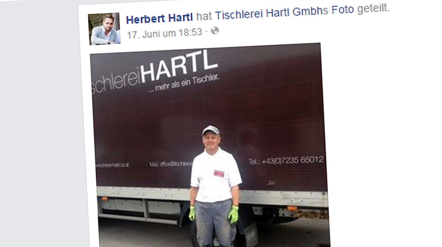 Der ehemalige Obdachlose Miroslav Sova steht in Arbeitsmontur vor einem Lieferwagen der Tischlerei Hartl