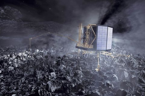 Raumsonde Philae, ein etwa kühlschrankgroßer und würfelförmiger Roboter, sitzt auf einem Kometen