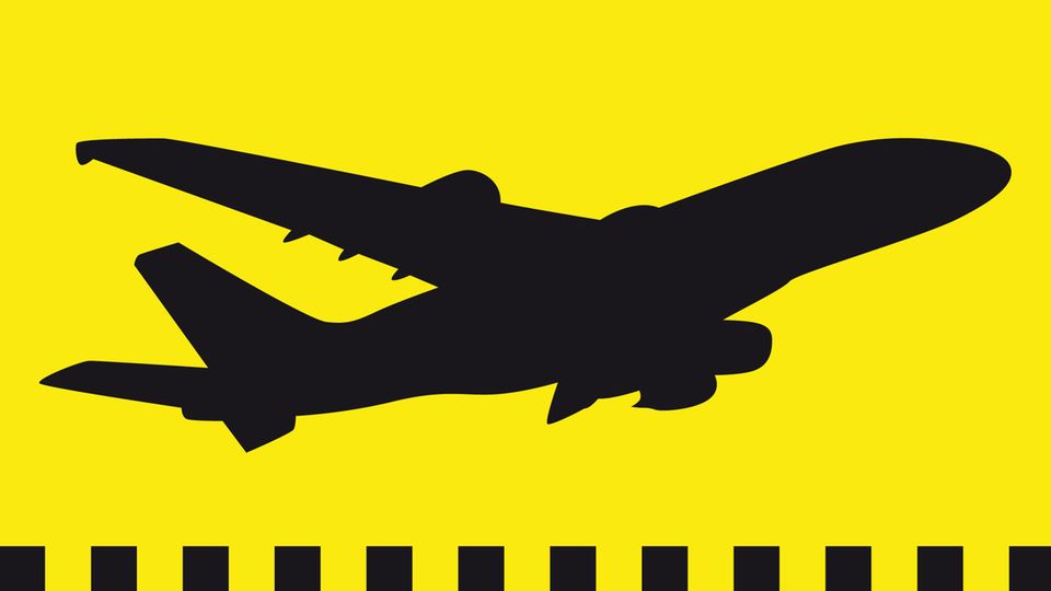 Ein schwarzes Flugzeug auf gelbem Hintergrund